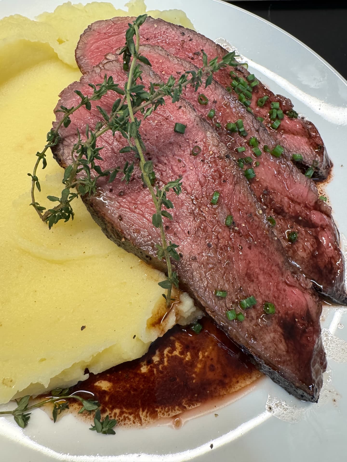 Roasted meat with mashed potatoes and demi-glace