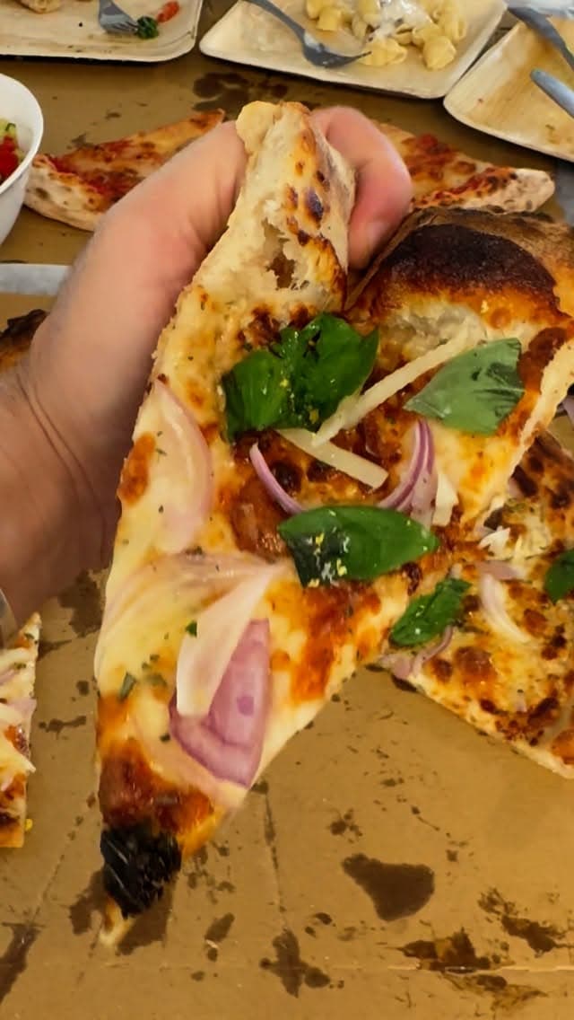 Neapolitan-style pizza with airy crust and leopard spotting